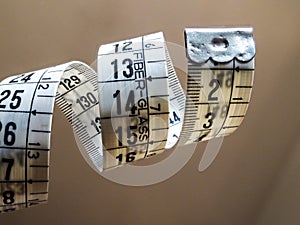 Tape measure used by dressmakers and tailors photo
