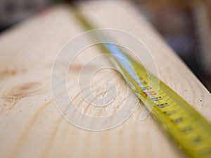 Tape measure on wooden batten