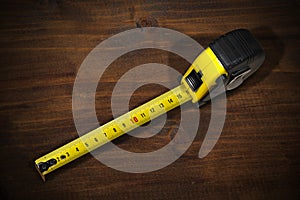 Tape Measure on a Wooden Work Table