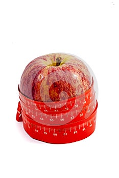 Tape measure wrapped round apple