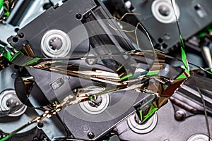 Tape pulled out from mini dv format video cassette tape