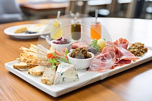 tapenade appetizer platter, cheese and meat accompaniments