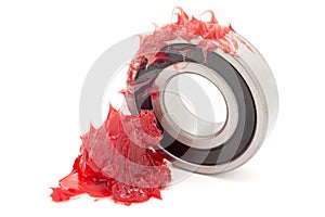 Tapered roller bearing with red lithium grease (Machinery Lubrication).