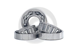 Tapered roller bearings and ball bearing isolated on white