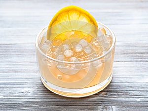 Tapioca balls with lemon slice in bowl on gray photo