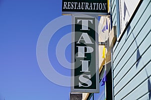 Tapis restauration french text sign means carpet restoration shop on wall facade store carpets restorer in france