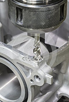 Tapping automotive part by cnc machining center