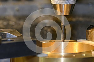 The tapping process on NC milling machine at the brass material parts