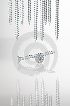 tapping screws made od steel, metal screw, iron screw, chrome screw, screws as a background