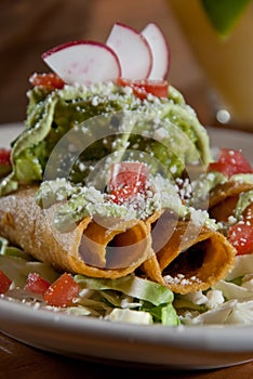 Taquitos and guacamole