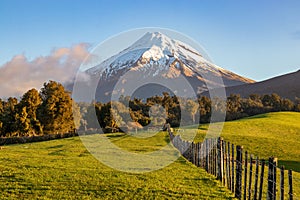 Taranaki volcano and picturesque farmland landscape, New Zealand