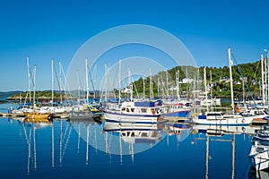 Tarbert marina with perfect blue sea and sky.