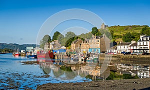 Tarbert pier with fisherman`s boats and ferry. photo