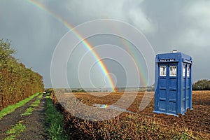 Tardis lands in meadow with rainbow