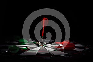 Target with arrow in the center on a black background
