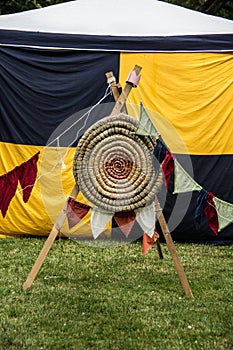 Target in front of a yellow black tent