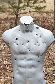 Target practicing with gun In the shooting range. Target for shooting. Outdoor.