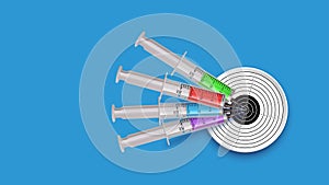 Target syringes on blue