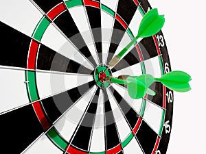 Target with three green dart focus on bull`s eye, Setting challenging business goals And ready to achieve the goal with teamwork