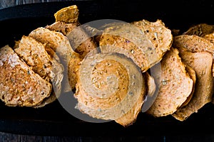 Tarhana cipsi / chips or crackers in a wooden bowl.