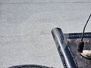 tarmac terrace insulation waterproof instalation worke working on the roof of a building