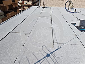 tarmac terrace insulation waterproof instalation worke working on the roof of a building
