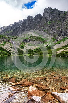 Tarn Velicke pleso and Velicky waterfall in High Tatras mountains, Slovakia