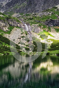 Tarn Velicke pleso and Velicky waterfall in High Tatras mountains, Slovakia