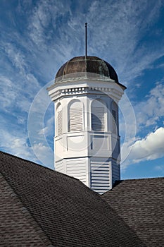 Tarnished Cupola on Roof Under Blue Skies