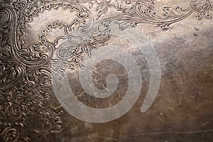 Tarnished silver scrollwork background