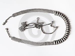 Tarnished vintage silver necklace and chain on white