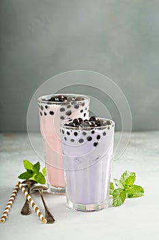 Taro and strawberry milk bubble tea in tall glasses
