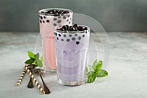 Taro and strawberry milk bubble tea in tall glasses