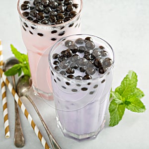 Taro and strawberry milk bubble tea in tall glasses