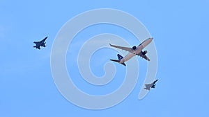 Tarom airplane surrounded by two fighter jets during air show