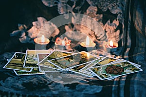 Tarot card with candlelight on the darkness background for Astrology Occult Magic illustration - Magic Spiritual Horoscopes and