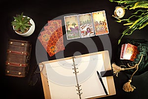 Tarot card reader arranges cards in a card spread photo