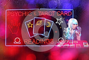 Tarot Card Readings Neon Sign in Window with Psychic Tarot Card Reader in background