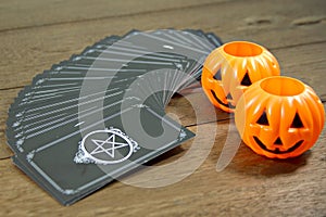 Tarot cards fortune teller with symbol Halloween on wooden table