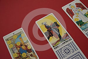 Tarot cards on the red surface - horizontal