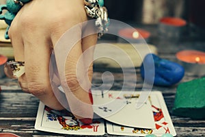 Tarot cards on the table. A woman fortune-teller predicts the future.