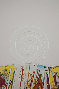 Tarot cards on the white surface with text space