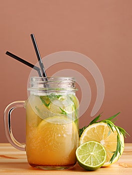Tarragon and citrus cocktail. lemonad concept. non alcoholic citrus summer drinks with citrus on wooden table. Deliciouse nature