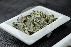 Tarragon leafs. Colorful spices in white bowls Seasonings for cooking.