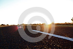 TARRED ROAD AT SUNSET