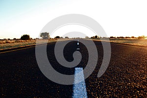 TARRED ROAD AT SUNSET