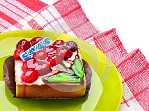 Tart with cherries on the plate