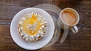 Tart and coffee on table