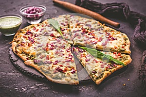 Tart flambee Flammkuchen with ramson sour cream, onion and bacon