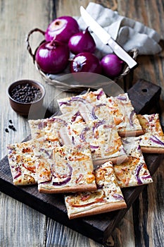 Tart flambee with purple onions, bacon and apples (Flammkuchen)